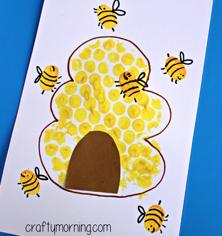 Bubble wrap art of Beehive and fingerprint yellow bees. 