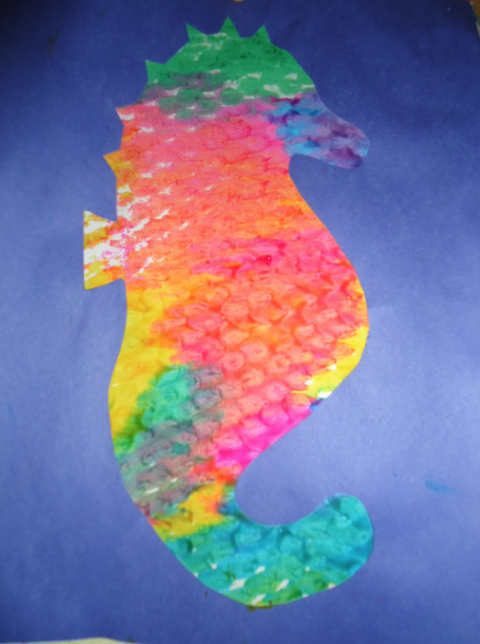 Bubble Wrap Art of a bright seahorse. 