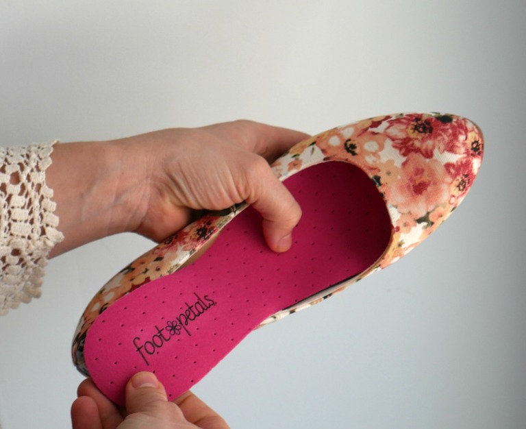 putting foot petal into shoe