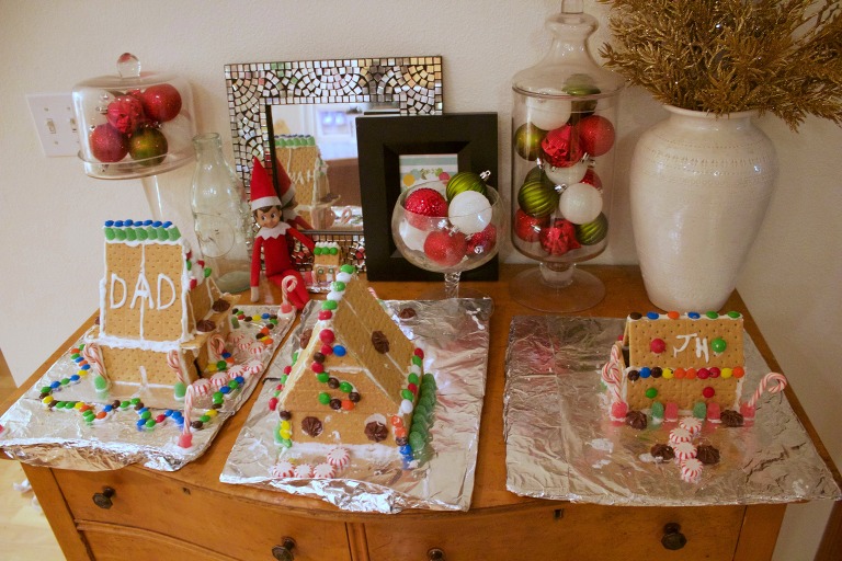 Elf on the Shelf making a Gingerbread house
