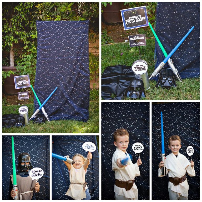 Kids taking pictures in Star Wars intergalactic photo booth with props. 