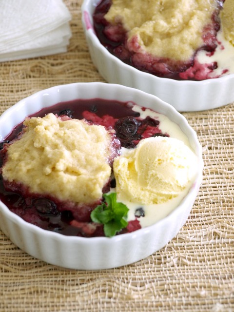 Crock Pot Blueberry Cobbler Cake topped with vanilla ice cream