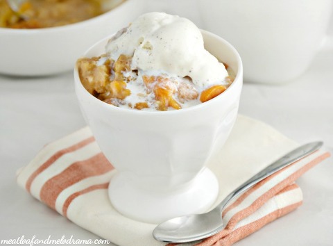 Crock Pot Peach Cobbler with vanilla ice cream on top