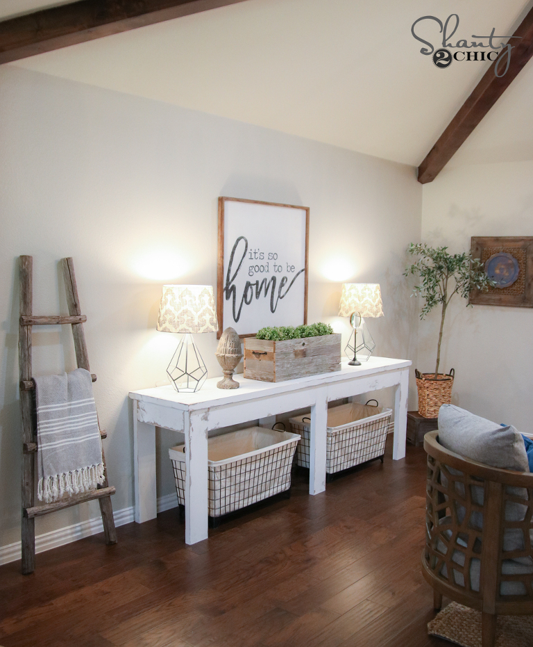 Farmhouse white entrance table with room decor. 