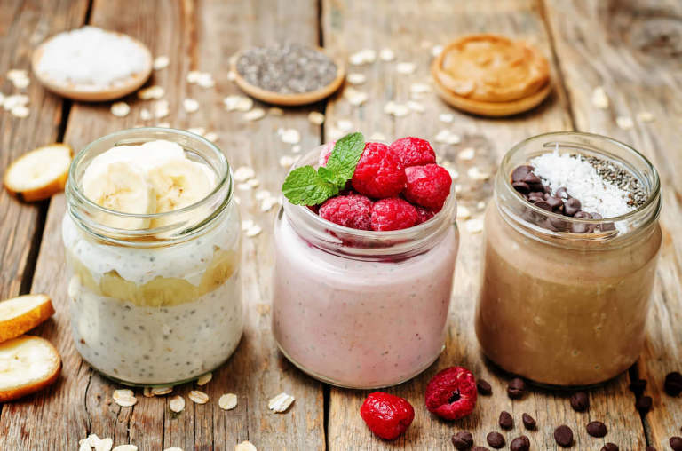 set overnight oats with berries, coconut, peanut butter, Chia se