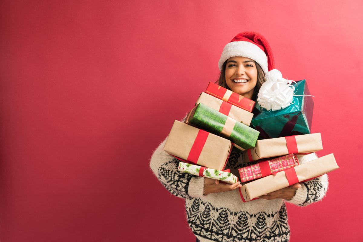 Lady holding Christmas presents