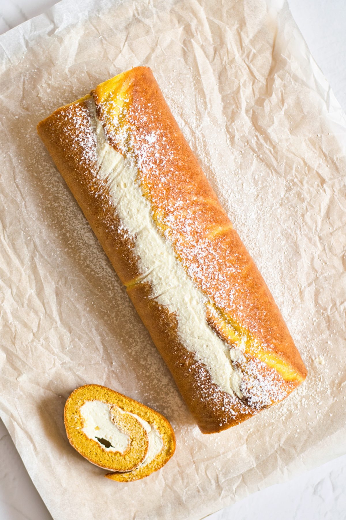 cutting the pumpkin roll
