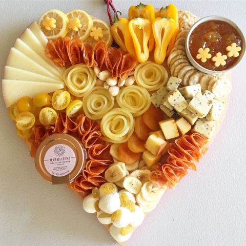 yellow heart shaped charcuterie board
